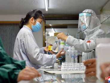 N.Korea says new fever cases under 100,000 as virus fight heats up 