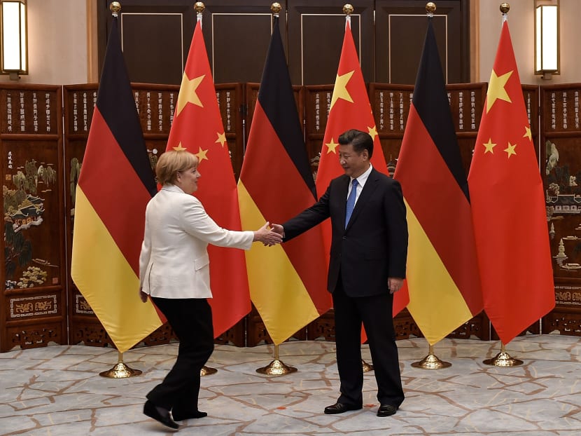 Chinese President Xi Jinping (right) shaking hand with German Chancellor Angela Merkel before their meeting at the West Lake State House in Hangzhou on Sept 5, 2016. Photo AFP