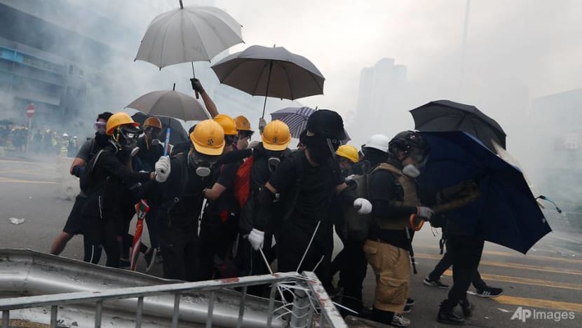 Tear gas fired, clashes at Hong Kong MTR station during banned protest