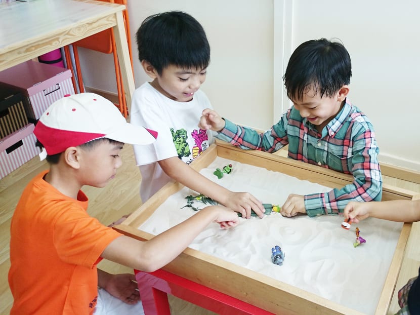 Play therapy can improve children’s perceptions about themselves and help them adjust socially, as seen in this posed photo. Photo: Creative Play Therapy
