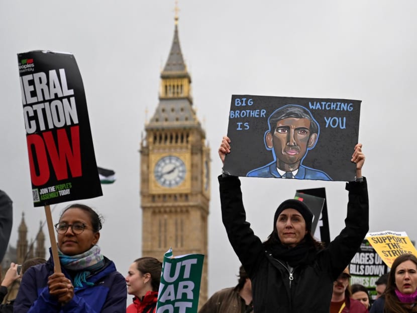 Demonstrators take part in a march past the Houses of parliament during a national demonstration in central London on Nov 5, 2022.
Demonstrators take part in a march past the Houses of parliament during a national demonstration in central London on Nov 5, 2022.