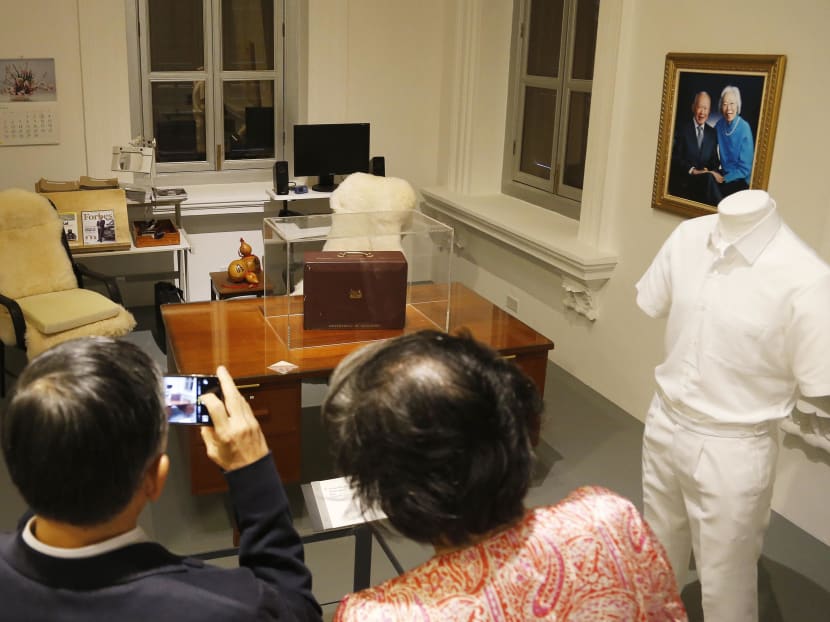 Visitors at the “We Built a Nation” exhibition at the National Museum of Singapore viewing an exhibit that is made up of furniture and artefacts from the study of Lee Kuan Yew’s Oxley road home. TODAY file photo