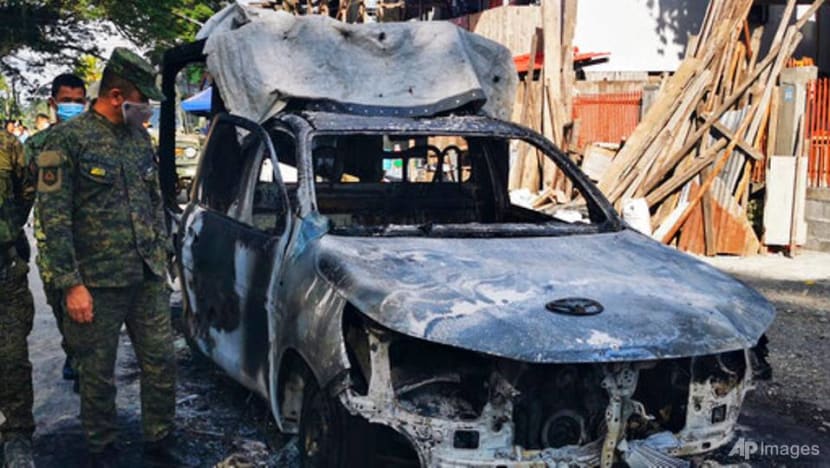 Militants open fire and burn police car in Philippine town Militants open fire and burn police car in Philippine town