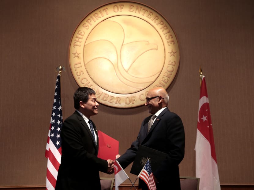 The MOU signing between Luke Goh (Singapore MTI) and Arun Kumar (US Dept of Commerce) at the US Chamber of Commerce on August 1, 2016. Photo: Jason Quah