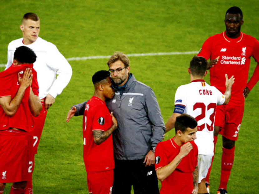 Jurgen Klopp’s (in grey) task is to reshape Liverpool in the summer transfer bazaar, where his judgment will be tested. Past errors must be corrected and overall standards raised in a team that finished eighth in the Premier League. Photo: Reuters