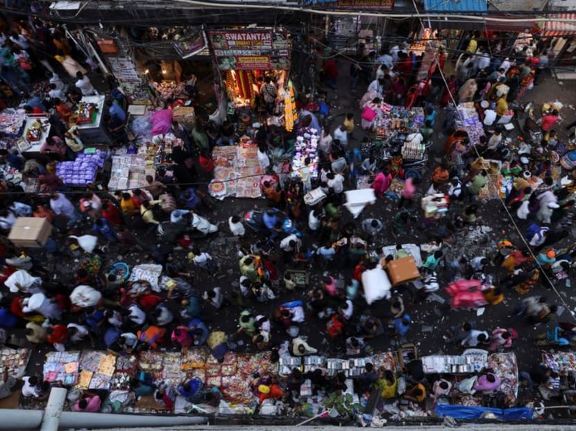 People shop at a crowded market in the old quarters of Delhi, India, in 2022. People shop at a crowded market in the old quarters of Delhi, India, in 2022.