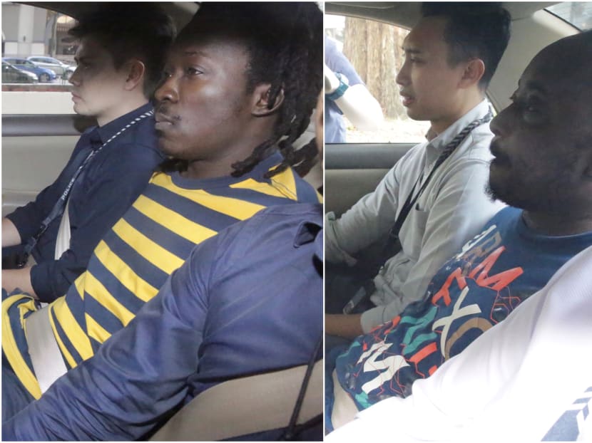 (From left) Nigerians Awolola Oladayo Opeyemi, 34, and Awolola Gbolahan Ayobami, 37, have been remanded in Singapore for further investigation into their involvement in a series of Internet love scams.