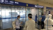 China slashes COVID-19 quarantine time for international travellers