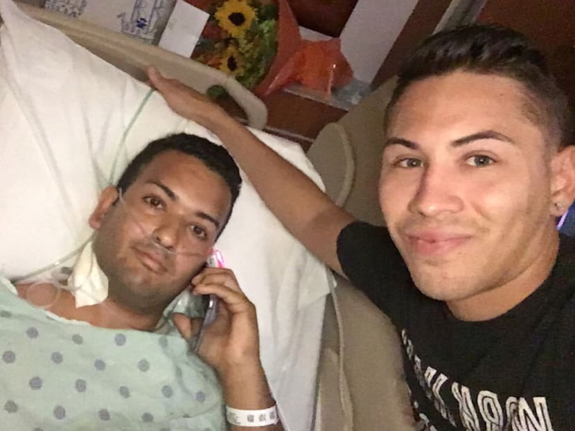 Mr Felipe Marrero, left, poses in his hospital bed in Orlando, Fla., in this image taken by his friend Joseph Rivera, right. Photo: AP