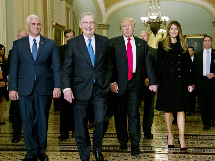 President-elect Donald Trump walking with Senate Majority Leader Mitch McConnell (left), Vice-President-elect Mike Pence (far left), and his wife Melania Trump on Thursday at Capitol Hill in Washington. Photo: AP