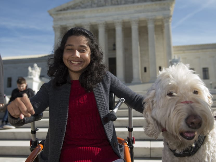 Ehlena Fry with her service dog Wonder outside the Supreme Court in Washington. Photo: AP