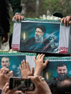 A picture of the late Iranian President Ebrahim Raisi is seen on his coffin during a funeral ceremony held in Tabriz, East Azerbaijan Province, Iran on May 21, 2024. REUTERS