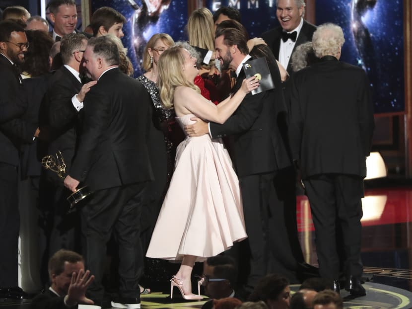 Bruce Miller with the cast and crew accept the award for Outstanding Drama Series to “The Handmaid’s Tale”. Photo: Reuters/Mario Anzuoni