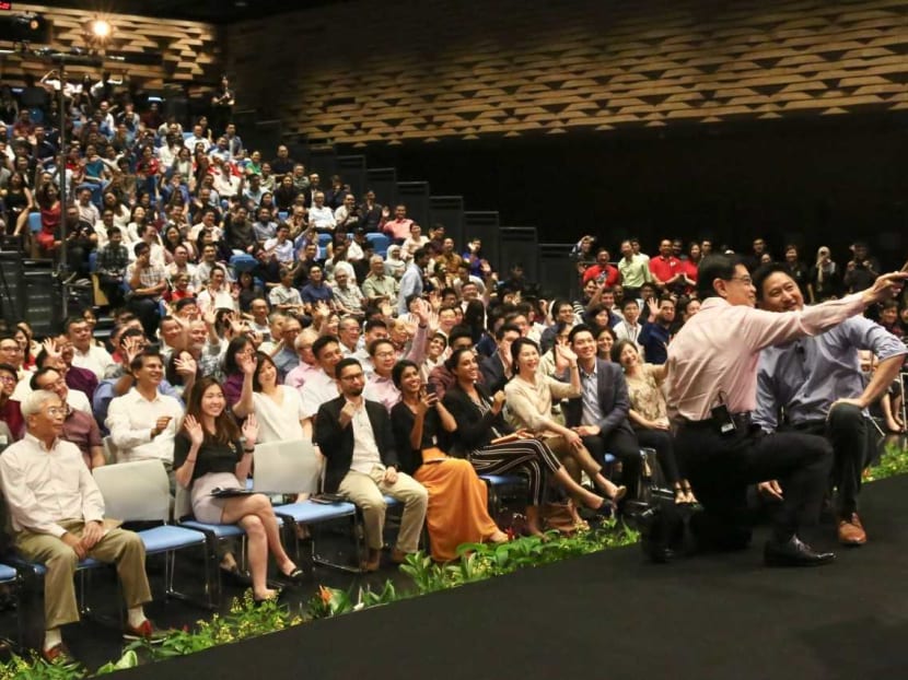 DPM Heng, seen here taking a wefie at Saturday's dialogue, said the Our Singapore Conversation project led to major policies such as the Pioneer Generation Package, MediShield Life and changes to the PSLE scoring system.