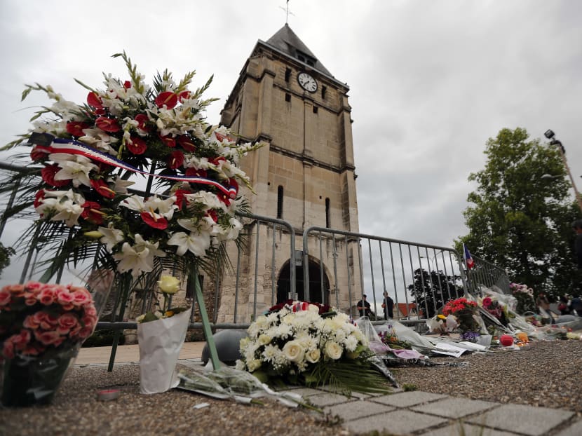 A wreath outside a church in St.-Étienne-du-Rouvray, a suburb of Rouen in northern France. Photo: AP