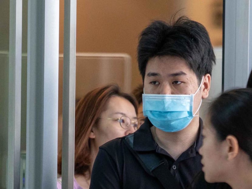 Ng Yong Kuan (with face mask) at the State Courts in October 2023.