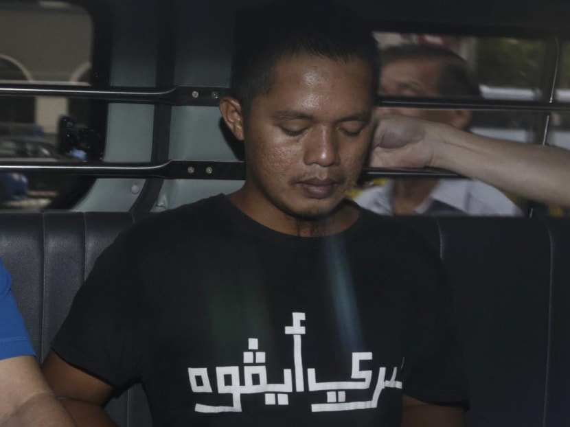 Donny Meluda, the last suspect in the 2010 Kallang slashing that left one dead and three injured, is seen under police escort.