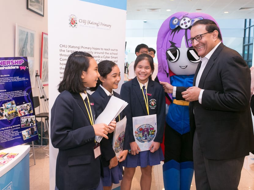 Communications and Information Minister S Iswaran (far right) interacting with student exhibitors from CHIJ (Katong) Primary School at the Better Internet Conference 2019. Communications and Information Minister S Iswaran (far right) interacting with student exhibitors from CHIJ (Katong) Primary School at the Better Internet Conference 2019.