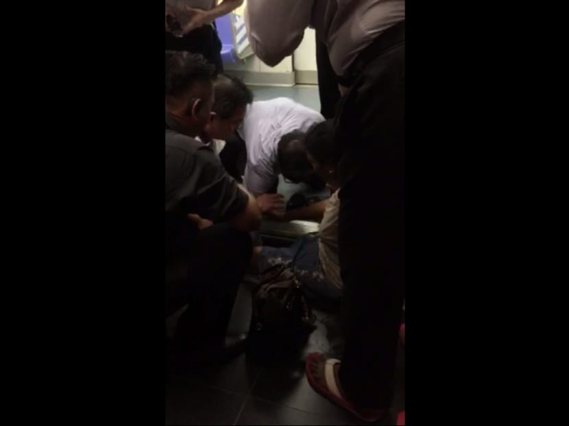 A female whose leg was stuck in the platform gap at Boon Keng MRT station was extracted by the SCDF this morning (May 14). Photo: Screengrab from video sent by Mr Mubarak John/MediaCorp hotline caller