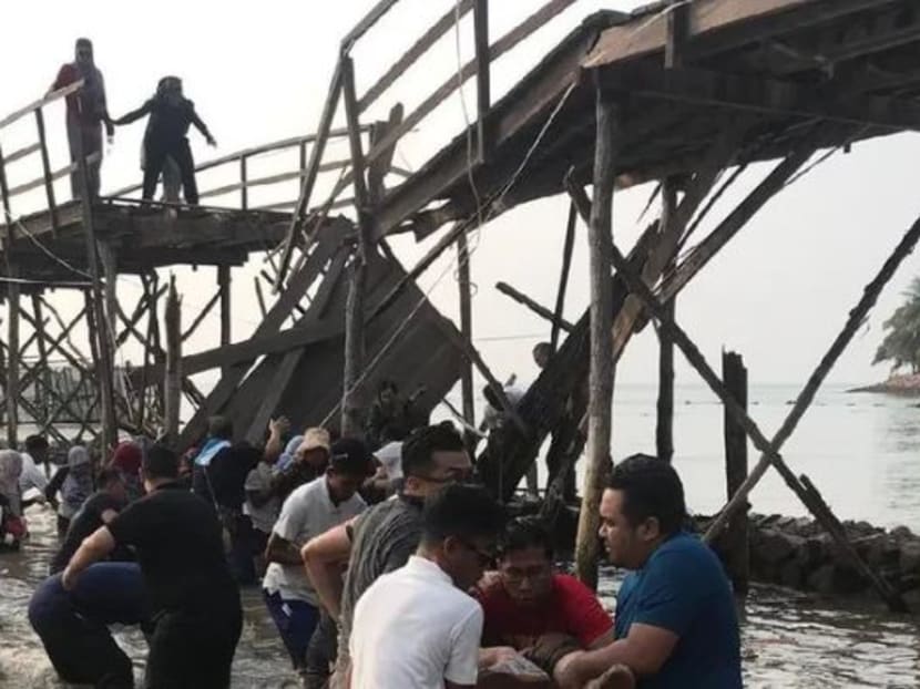 According to Indonesian media outlet Sindonews.com, the Singaporean tourists were taking selfies on the 70m-long wooden bridge at the Montigo Resorts in Nongsa, Batam, when it collapsed in the middle.