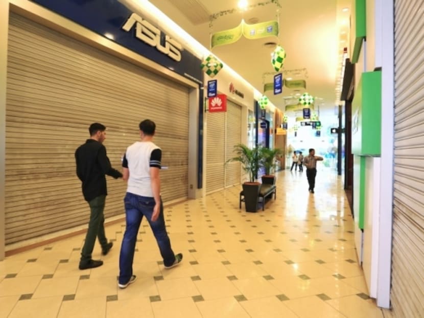 Many IT shops are shuttered following a brawl at Low Yat Plaza. Photo: The Malay Mail Online