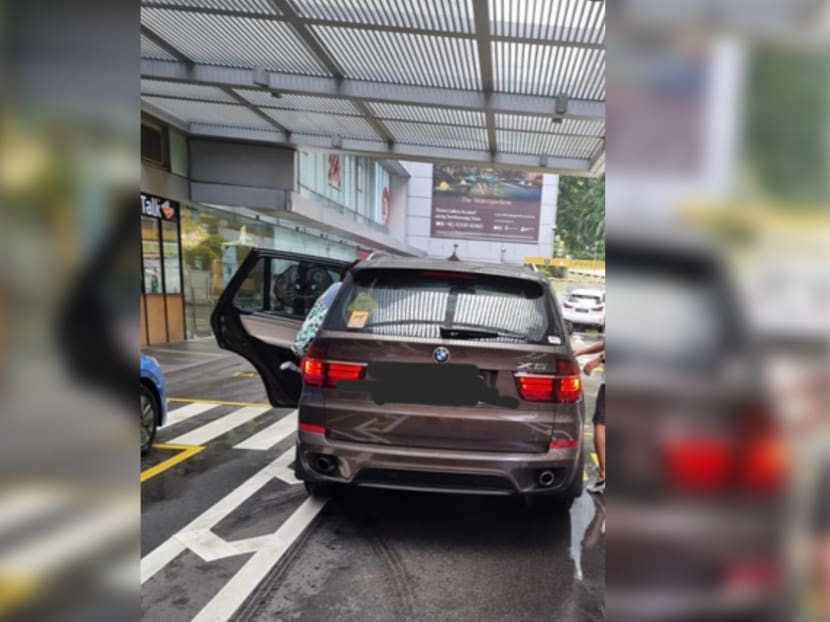A view of a BMW parked outside United Square mall in the Novena area. Its driver is alleged to have injured a security guard there.