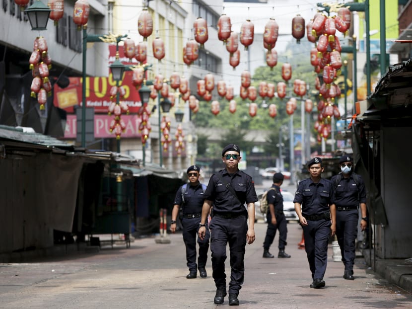 Malaysian police patrolling a street in Chinatown, Kuala Lumpur. The Malaysian police have been under the spotlight recently for a series of blunders and disciplinary violations which analysts attribute to a lack of reforms in the force. Photo: Reuters