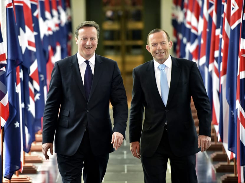 British Prime Minister David Cameron (left), with his Australian counterpart Tony Abbott, leaving  Parliament House in Canberra yesterday. Photo: AP