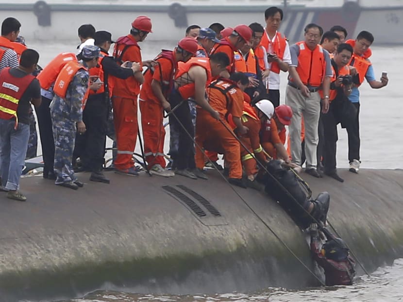 More than 400 still missing from capsized cruise ship in China
