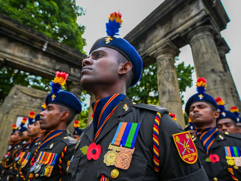 Members of Sri Lankan military personnel attend a ceremony to mark Poppy day or Remembrance day to pay respect to fallen war veterans from the two World Wars as well as from the internal Tamil separatist conflict, at the war memorial in Colombo on Nov 13, 2022.
