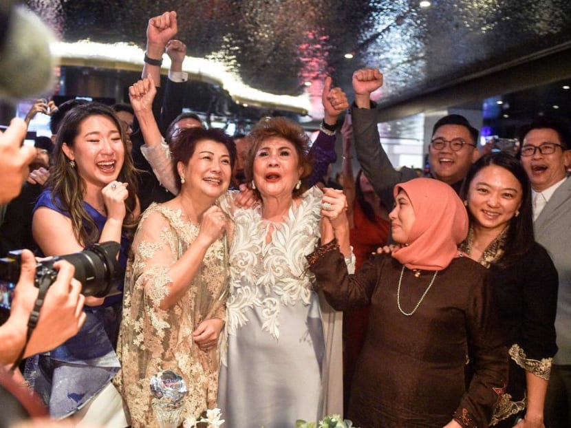 Ms Janet Yeoh (centre right), mother of actress Michelle Yeoh, celebrates after her daughter won the award for Best Actress in a Leading Role at the 95th Academy Awards in Los Angeles, at an event in Kuala Lumpur on March 13, 2023.