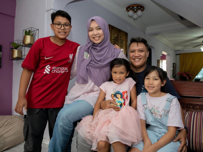 Singaporean couple, Mr Muhammed Ridzwan Aminuddin, 40, and Ms Nurulhuda Sa’ari, 38, with their three children, Mikhael Muhammed Ridzwan, 12, Indah Muhammed Ridzwan, 6, and Nayla Muhammed Ridzwan, 9, on July 29, 2022. 