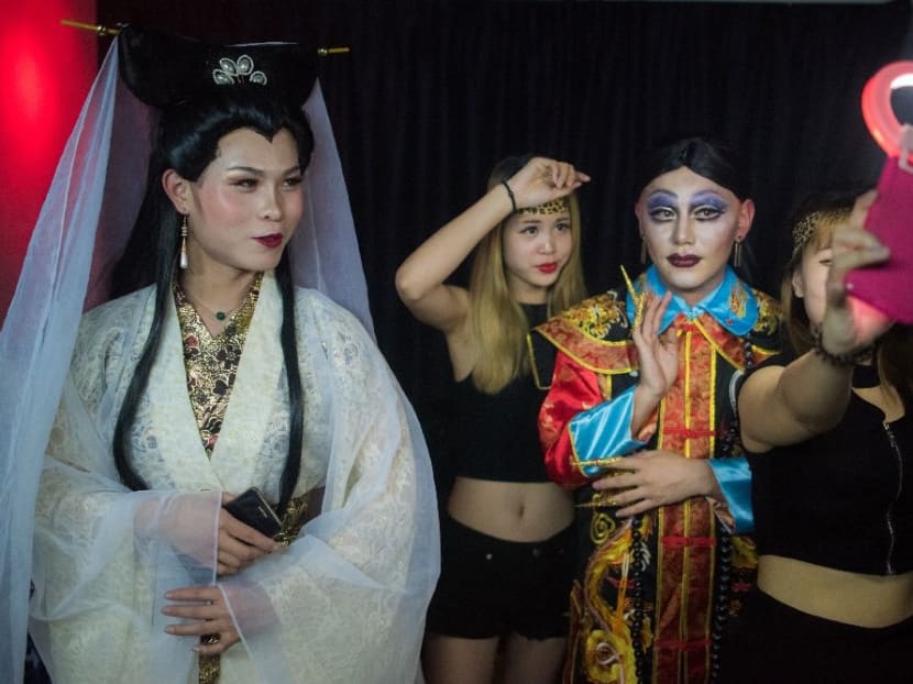 Contestants pose for a selfie before the final of Big Queen, a cross-dressing contest at the Icon Club in Shanghai. Photo: AFP