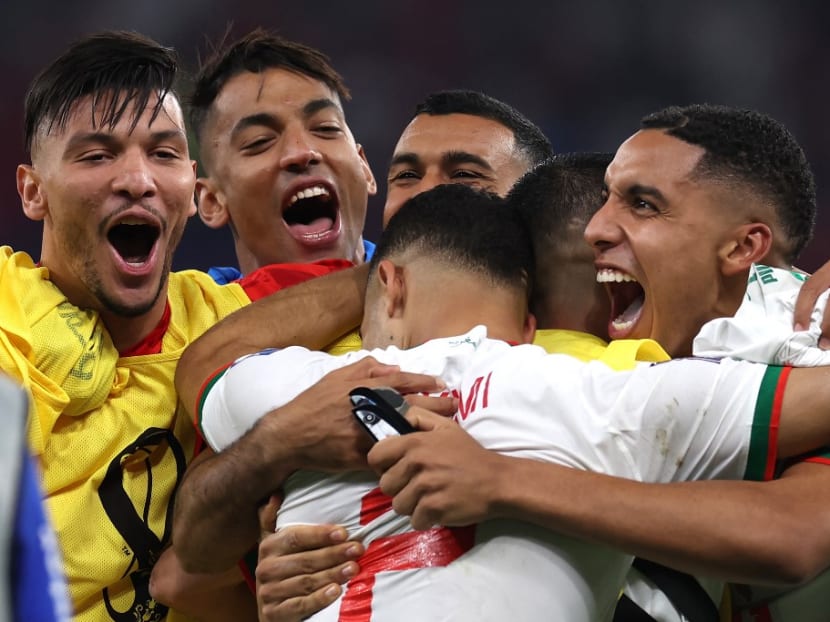 Morocco's players celebrate winning the Qatar 2022 World Cup Group F football match between Canada and Morocco at the Al-Thumama Stadium in Doha on Dec 1, 2022.
