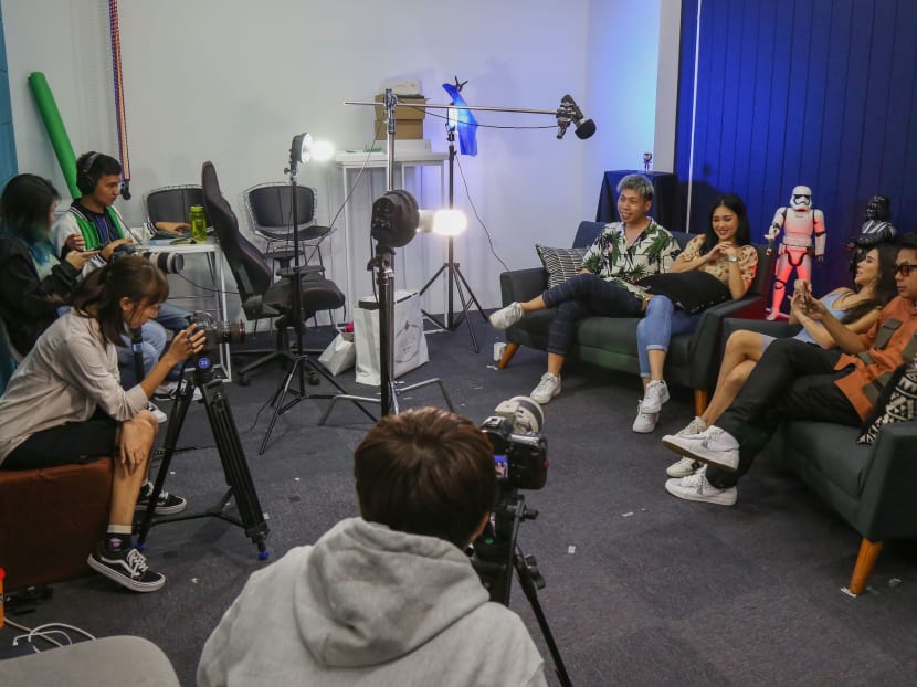 (Fourth from right) Mr Johnathan Chua, seen here on set during a filming session for one of the episodes of the online talk show, Real Talk.