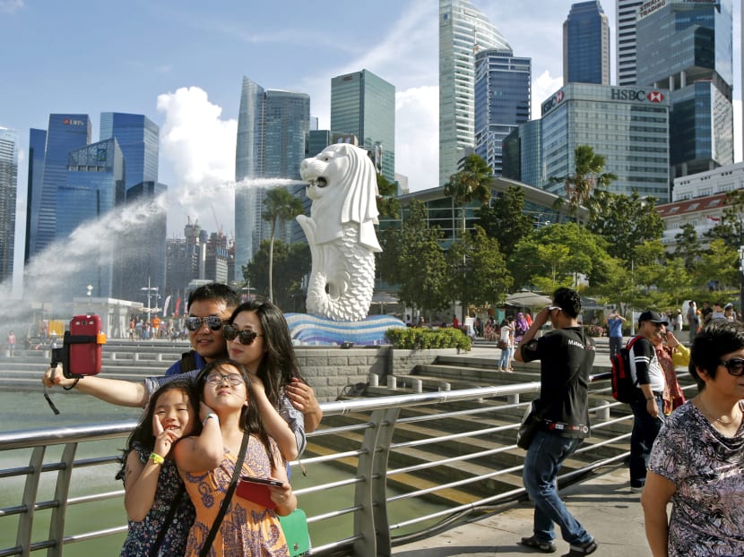 Tourists taking photos by the Merlion. In the first 11 months of last year, there was 'good growth' in the number of visitors from key markets such as China (up 21%), India (up 7%) and Taiwan (up 11%). Reuters file photo