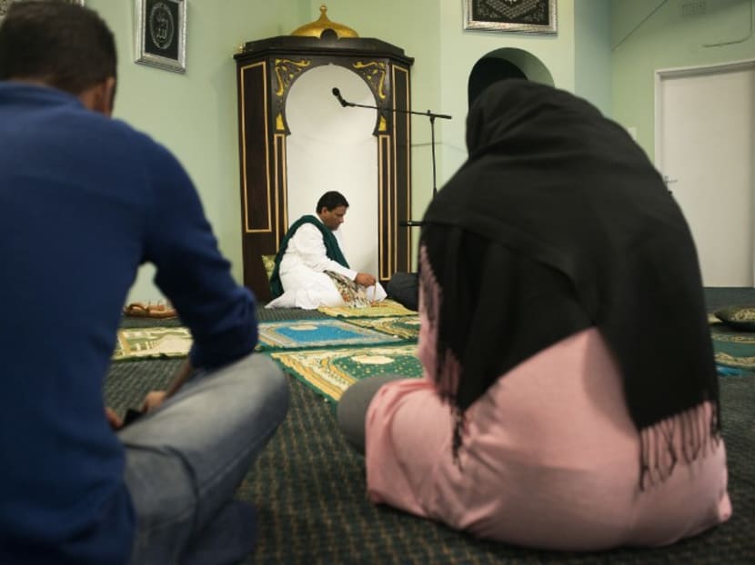 Imam Muhsin Hendricks (centre) leads the start of the Jumu'ah (friday) prayer at the Inner Circle Mosque. Photo: AFP