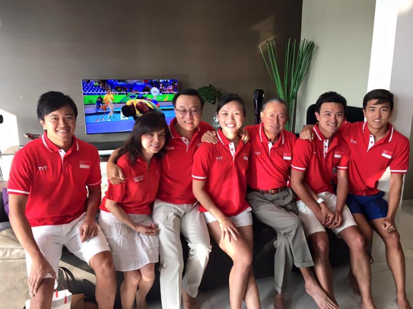 Colin Schooling (3rd from right) sits with family and friends ready to watch the 100m butterfly final on Saturday (Aug 13). Photo: Adelene Wong