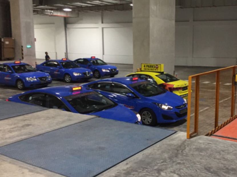 ComfortDelGro taxis seen waiting at the loading area of Amazon's warehouse at Toh Guan Road East in this photo taken around 7.30pm on July 28. Photo: Chris Koh