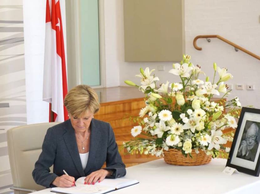Australia’s Foreign Minister Julie Bishop signing the condolence book at the Singapore High Commission in Canberra yesterday. The country’s thoughts are with Singapore as it mourns its founding father, she wrote. Photo: Singapore High Commission in Canberra