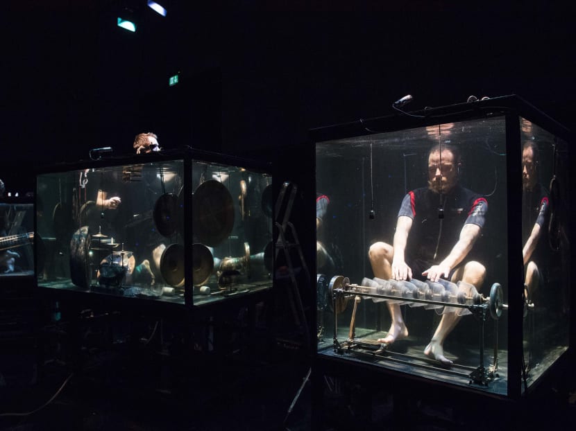 Members of the Between Music band, performing with custom-made instruments in a glass water tank during a rehearsal ahead of the AquaSonic underwater concert on April 19, 2017 in Aarhus, Denmark.
