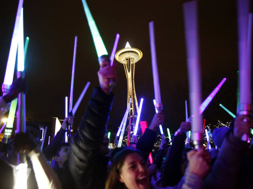 Star Wars fans gather underneath the Space Needle on Saturday, Dec. 19, 2015, to wage a lightsaber battle in Seattle. Photo: The Seattle Times via AP