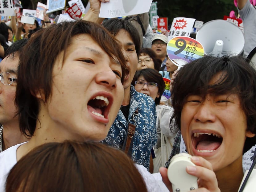 Tens of thousands protest defence bills outside Japan’s parliament