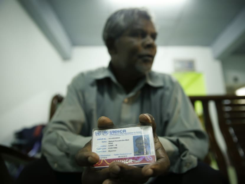 In this May 21, 2015 photo, Rohingya Hamid Hussein Abul Khair shows his United Nation Refugee Identity card during an interview with the Associated Press in Kuala Lumpur, Malaysia. Photo: AP