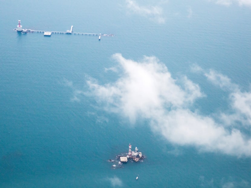 Malaysia has constructed a maritime base on Middle Rocks comprising a jetty linking the two main outcrops, a lighthouse and a helipad. The base lies close to Singapore's Pedra Branca, which can be seen at the bottom of this photo. Malaysia has constructed a maritime base on Middle Rocks comprising a jetty linking the two main outcrops, a lighthouse and a helipad. The base lies close to Singapore's Pedra Branca, which can be seen at the bottom of this photo.