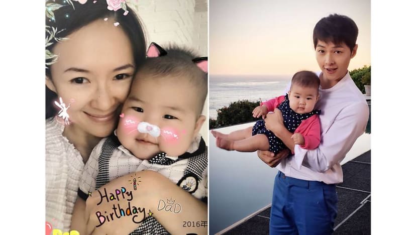 Song Joong-ki poses for a picture with Zhang Ziyi’s daughter