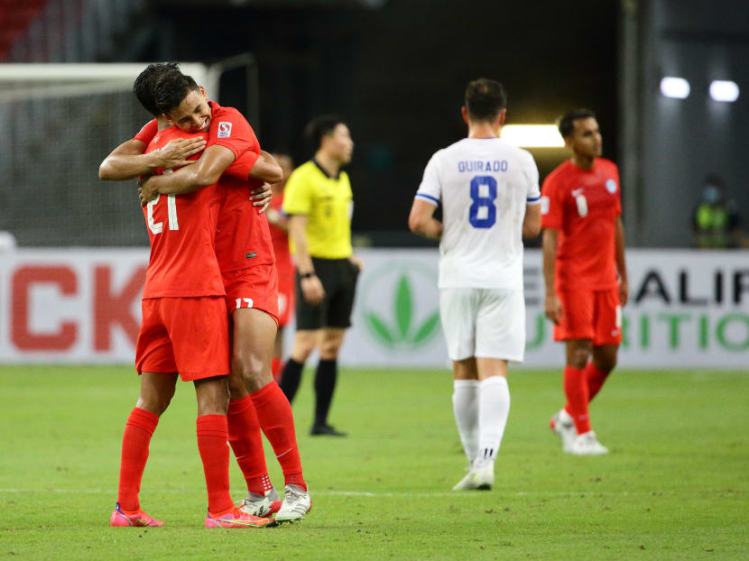 Safuwan Baharudin (left) celebrates with Irfan Fandi at the final whistle after defeating Philippines during the AFF Suzuki Cup 2020 Group A match between Philippines and Singapore at National Stadium on Dec 8, 2021 in Singapore. 
