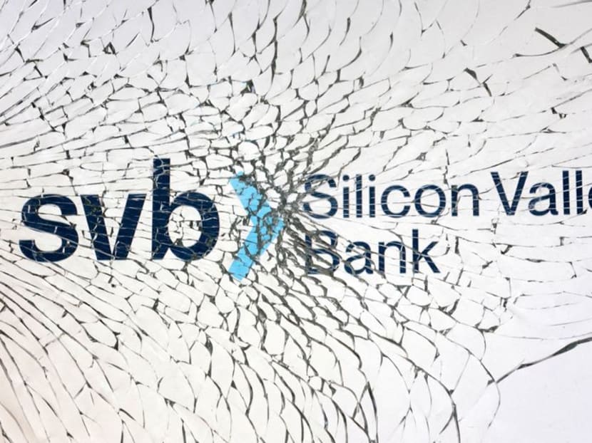 The Silicon Valley Bank logo is seen through broken glass in this illustration taken March 10, 2023. 