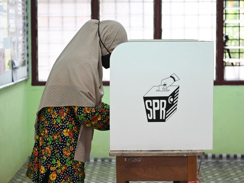 A woman casts her vote at a polling station during the 15th general election in Bera, Malaysia's Pahang state on Nov 19, 2022.
A woman casts her vote at a polling station during the 15th general election in Bera, Malaysia's Pahang state on Nov 19, 2022.