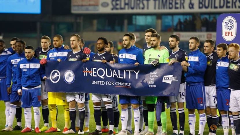 Football: Millwall fans applaud anti-racist banner Football: Millwall fans applaud anti-racist banner